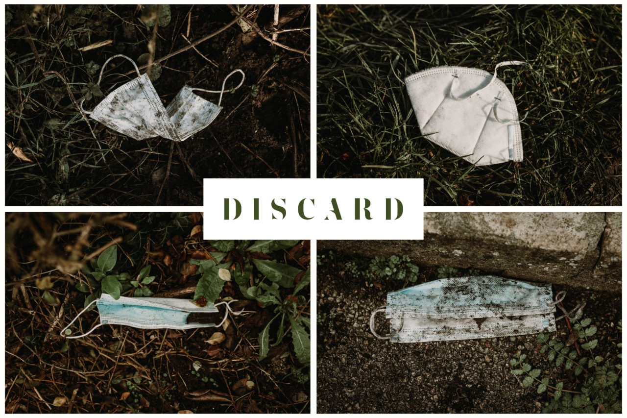 Four littered face masks thrown on the ground with the word DISCARD written over the top