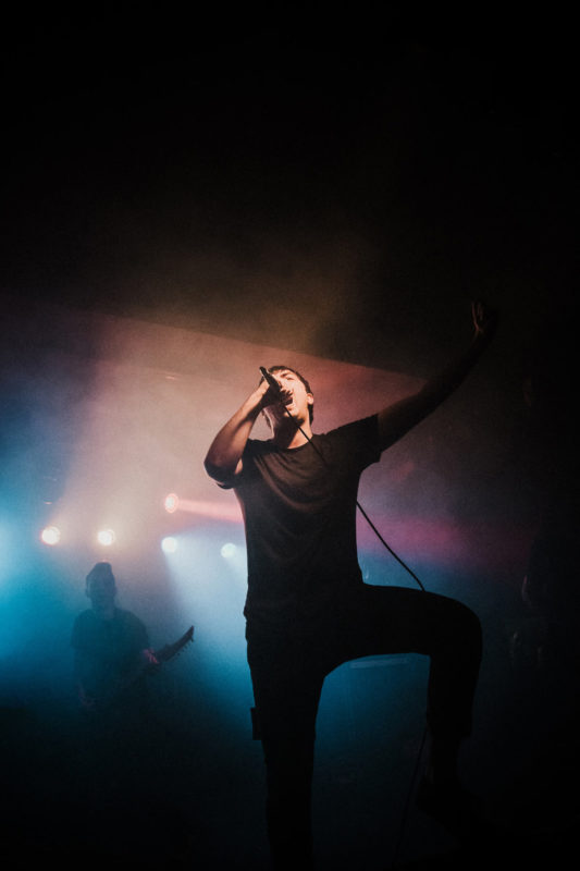 Make Them Suffer singer on stage in Bristol