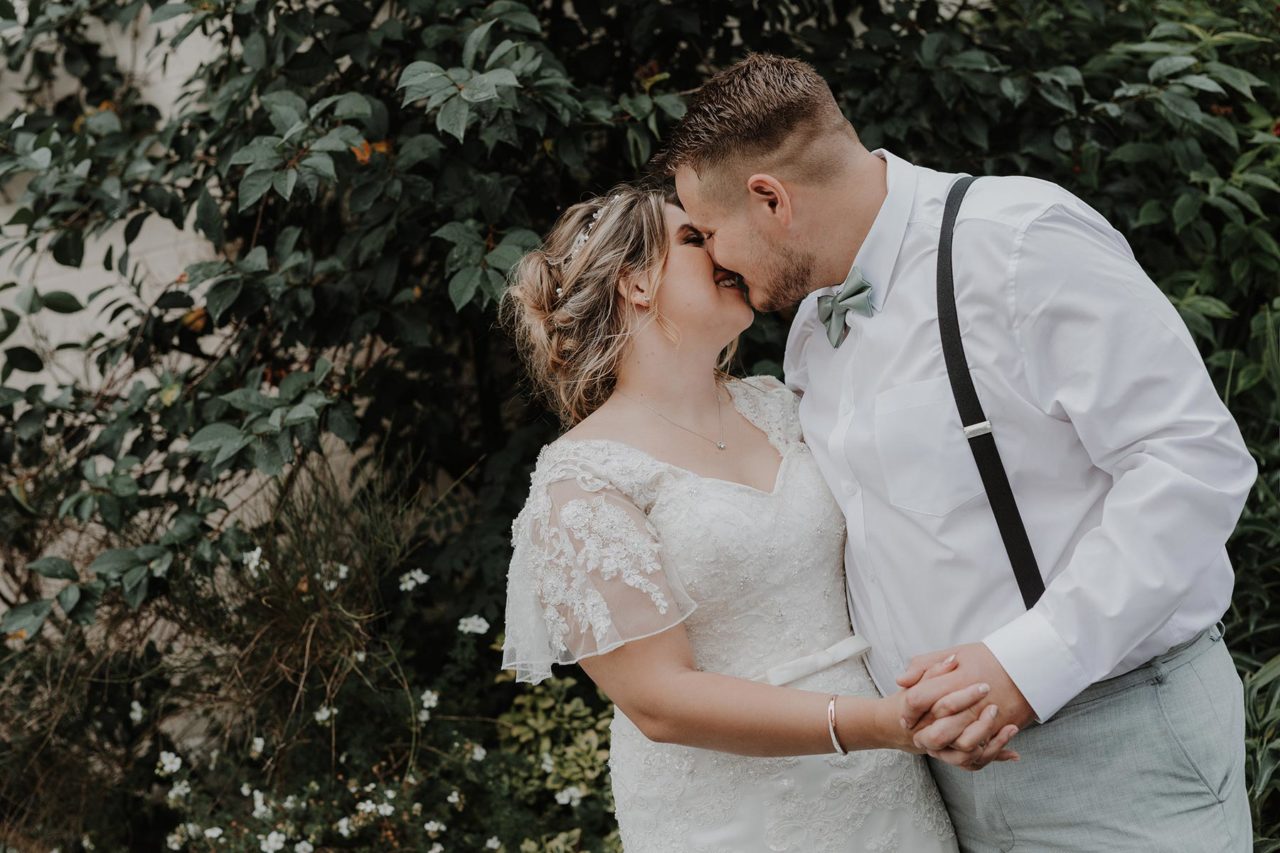 Happy couple sharing a quiet kiss