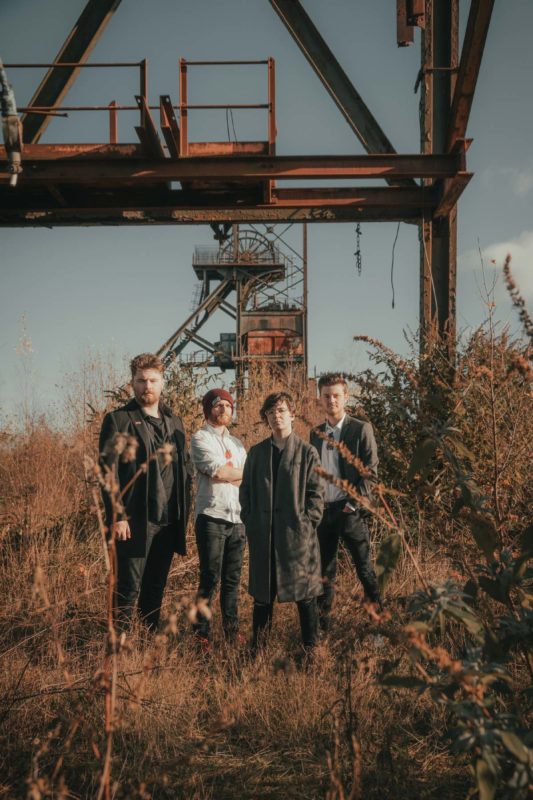 Band stood beneath decommissioned mineshaft on a cold autumn morning