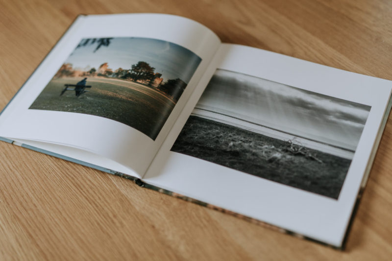 Inside of Caldicot book, led opened on a worktop, with a double page spread of images