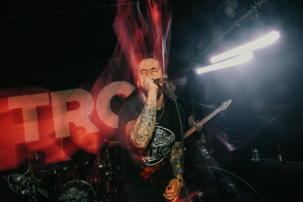 TRC frontman screaming on stage