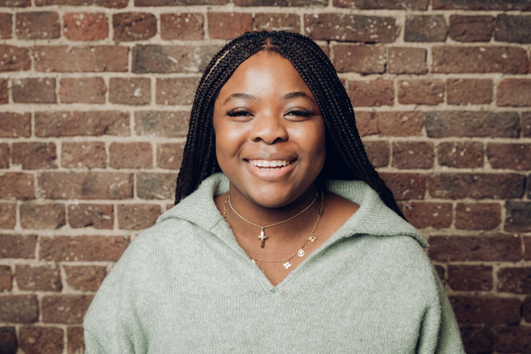 Happy looking woman smiling to the camera during a studio shoot