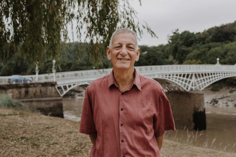 Deputy Council Leader Paul Griffiths stands in front of River Wye bridge in Chepstow