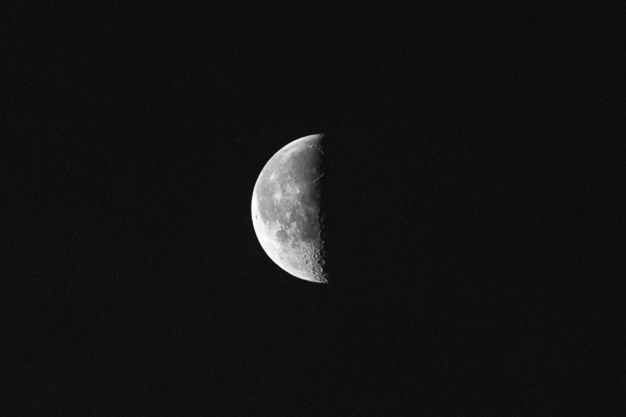 Close up of the Moon half covered in darkness over Pembrokeshire