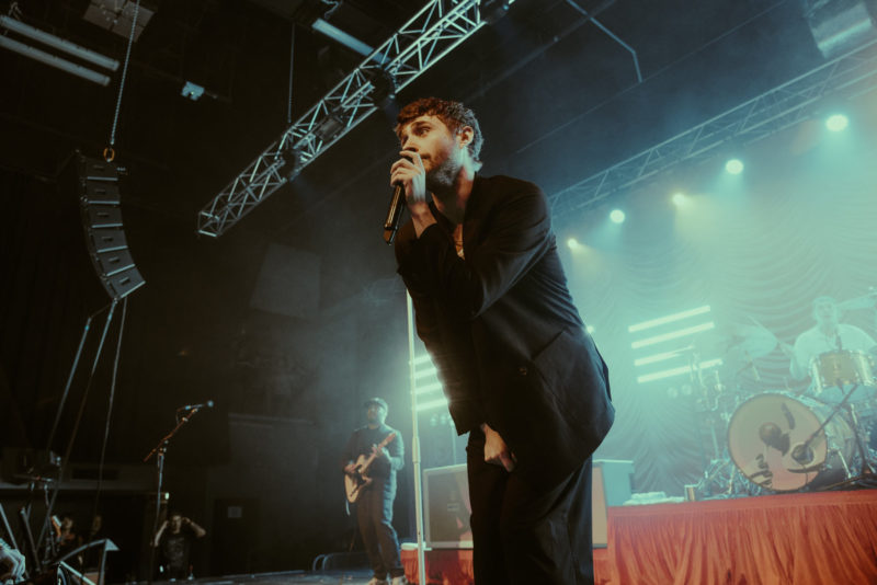 Kids In Glass Houses singer Aled Phillips stood on stage singing to the crowd in Cardiff's Great Hall