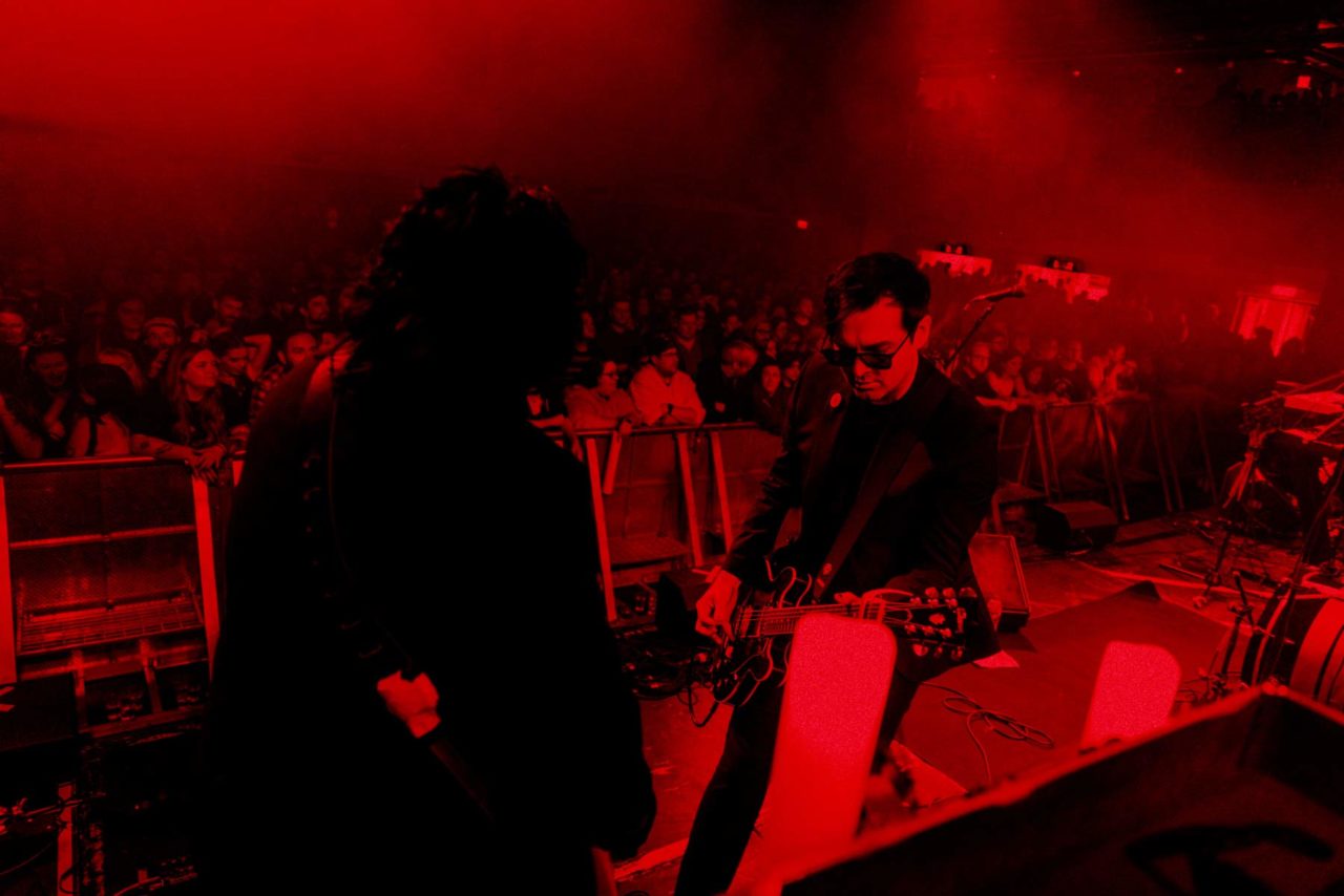 Goth rock band The Nightmares playing the Great Hall in Cardiff with huge crowd in the background