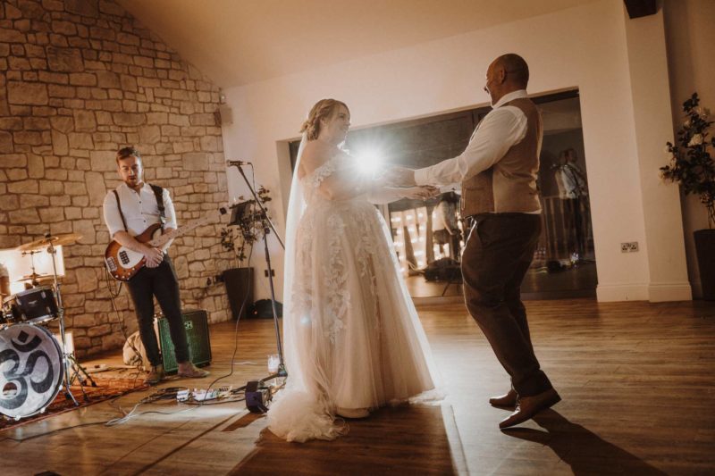 Kirsty and Jason laughing and enjoying their first dance together