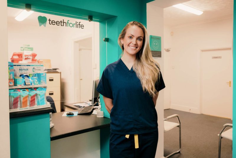 Professional portrait of a member of staff smiling. Shot for teeth For Life in Caldicot, December 2023.