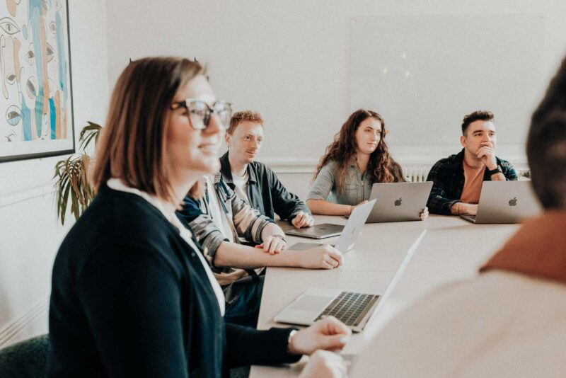 Marketing team sat around a table during a creative brief.
